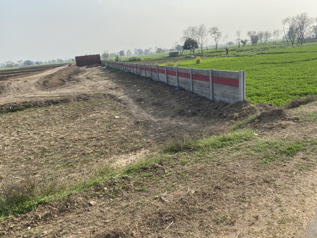 Precast wall boundary on agricultural land